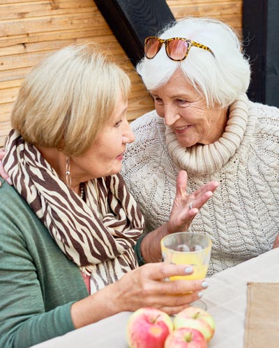 two older women talking at Encore Luxury Living apartments